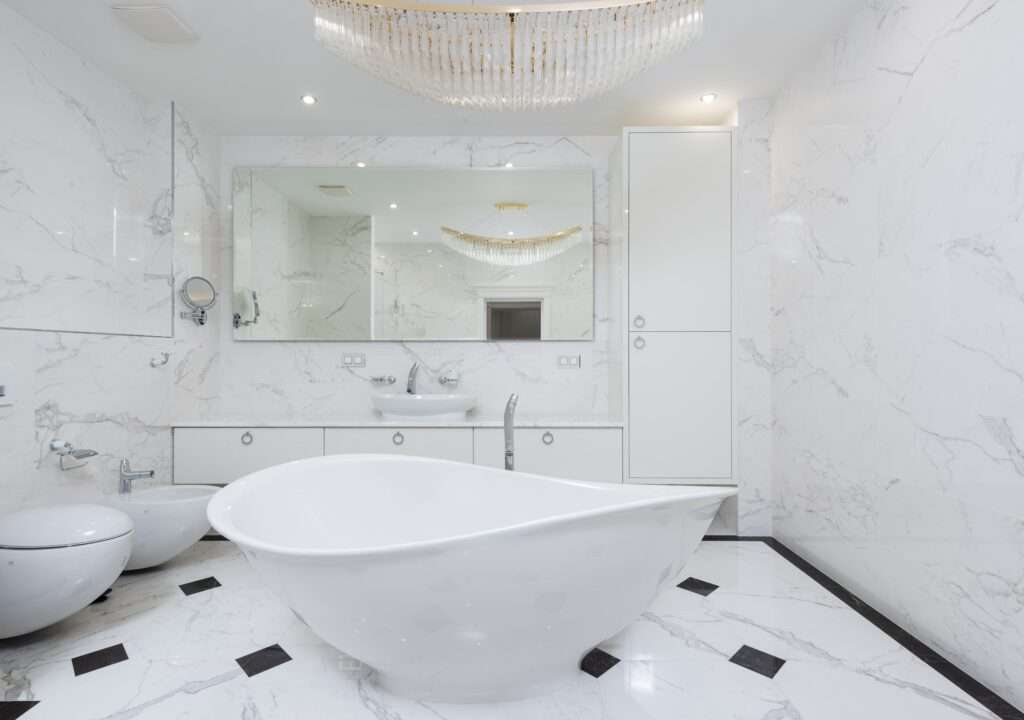 An image of a modern bathroom with statement lightning